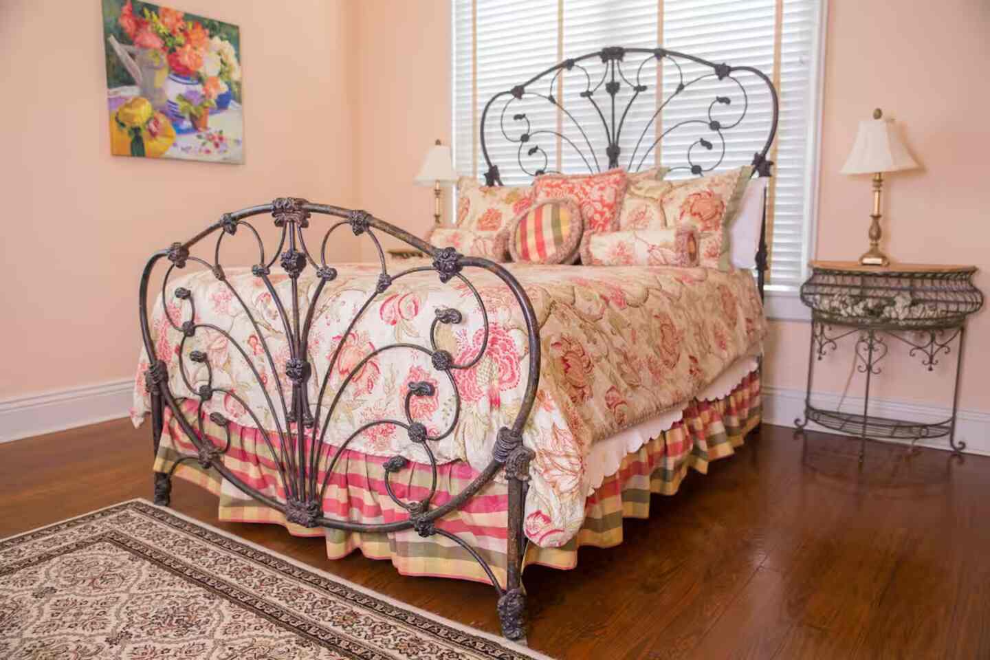 A guest room with a daybed and classic toile walls